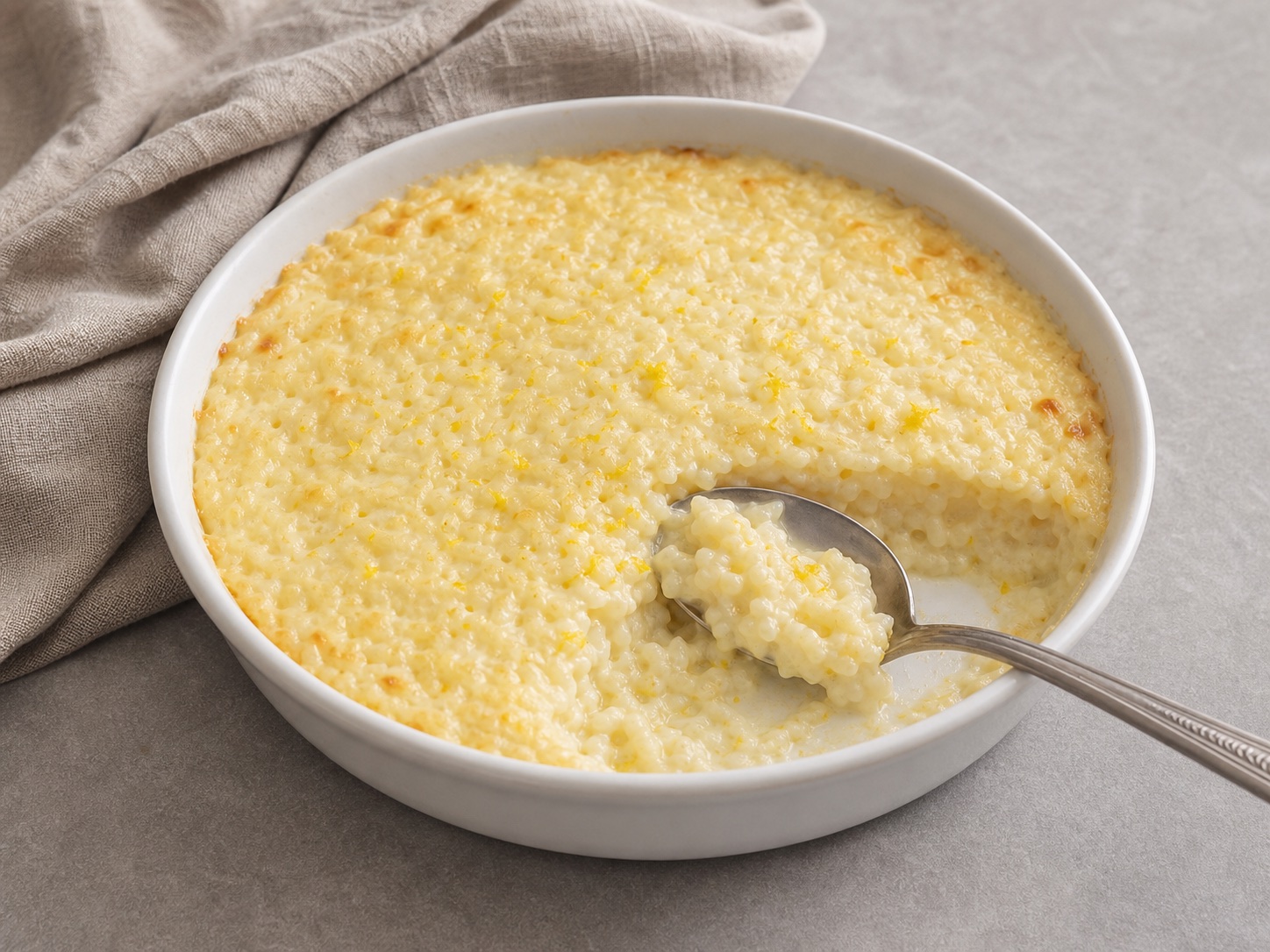 Slow-Baked Lemon Rice Pudding, an original illustrative image based on the cited recipe